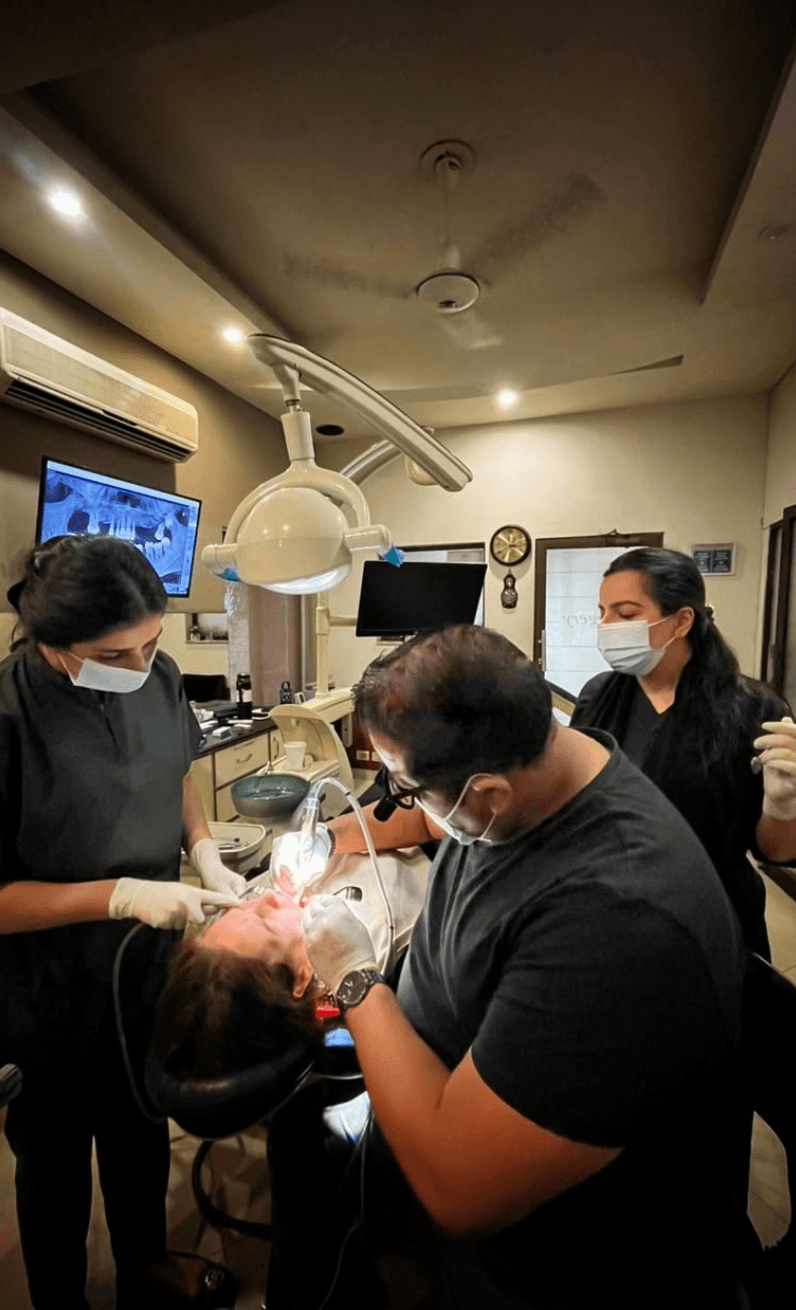Dr. Omar Sheikh performing a dental procedure